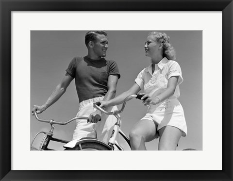 Framed 1930s 1940s Smiling Couple On Bikes Looking At One Another Print