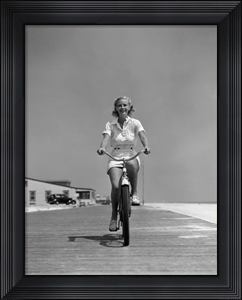 Framed 1940s Summer Time Smiling Woman Riding Bike On Beach Boardwalk Print
