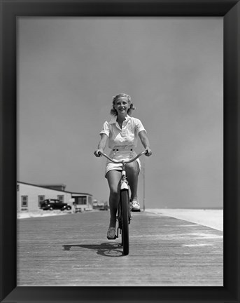 Framed 1940s Summer Time Smiling Woman Riding Bike On Beach Boardwalk Print