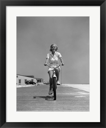 Framed 1940s Summer Time Smiling Woman Riding Bike On Beach Boardwalk Print