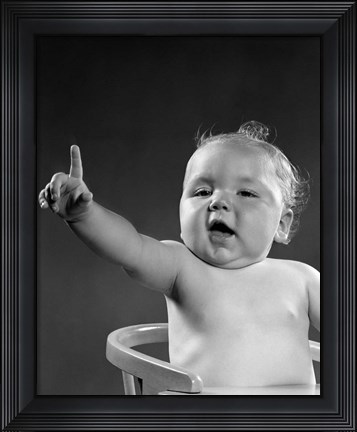 Framed 1940s 1950s Baby Sitting In Chair Arm And One Finger Raised Print
