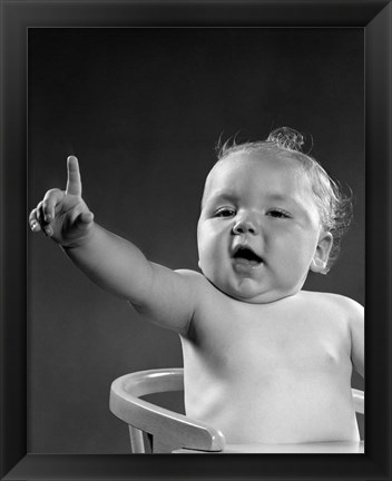 Framed 1940s 1950s Baby Sitting In Chair Arm And One Finger Raised Print