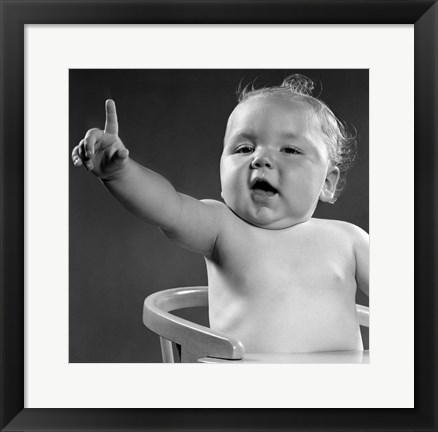 Framed 1940s 1950s Baby Sitting In Chair Arm And One Finger Raised Print
