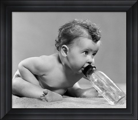 Framed 1950s Baby Leaning Forward Drinking From Bottle Print