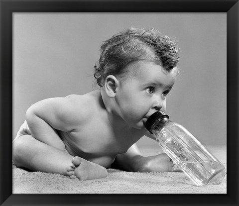 Framed 1950s Baby Leaning Forward Drinking From Bottle Print