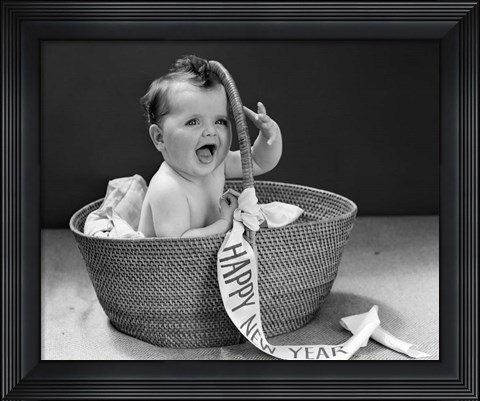 Framed 1940s Baby In Wicker Basket With Happy New Year Banner Print