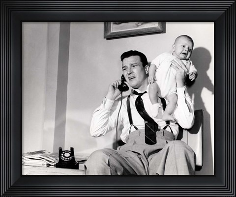 Framed 1950s Father Holding Baby While On The Phone Print