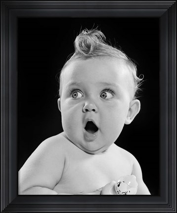 Framed 1950s Wide Eyed Baby Holding Toy Rattle Print