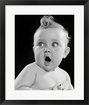 Framed 1950s Wide Eyed Baby Holding Toy Rattle Print