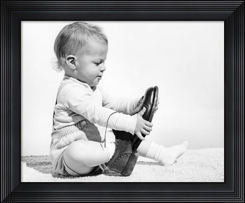 Framed 1960s Baby Boy Trying To Put On Man&#39;S Shoe Print