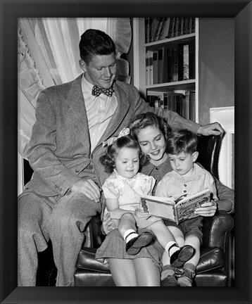 Framed 1940s Father Watching  Mother Reading To Son And Daughter Print