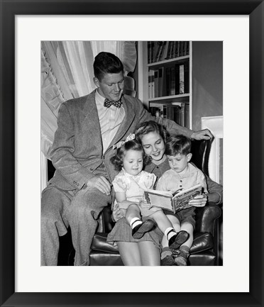 Framed 1940s Father Watching  Mother Reading To Son And Daughter Print