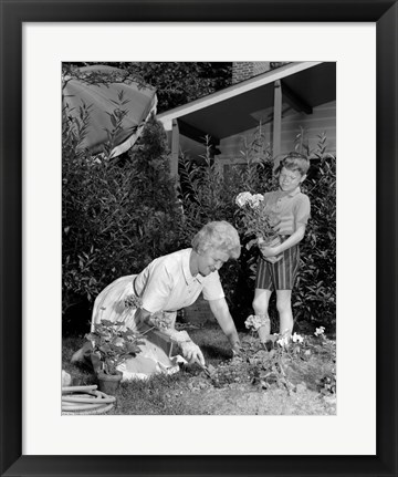 Framed 1960s Boy Helping Grandmother Plant Flowers Print