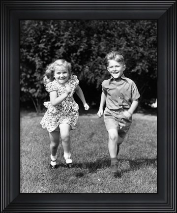Framed 1930s 1940s Boy And Girl Running In Backyard Print