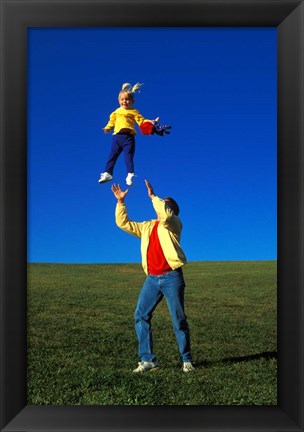 Framed 1990S Father Tossing Daughter Up In The Air Print