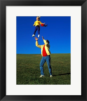 Framed 1990S Father Tossing Daughter Up In The Air Print